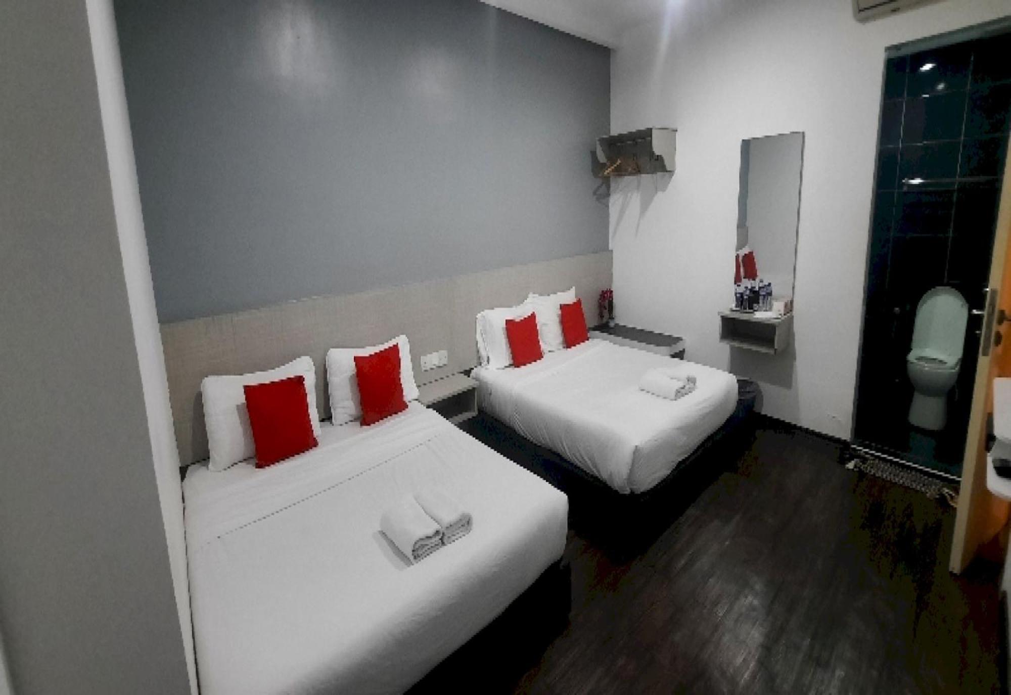 Super Oyo 90724 Rg Hotel Air Hitam المظهر الخارجي الصورة
